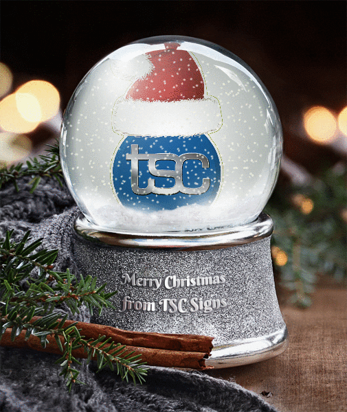 snowglobe with TSC logo in a Santa Hat