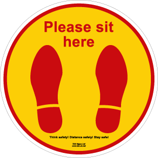 Please sit here (floor sign)