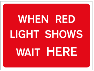 WHEN RED LIGHT SHOWS WAIT HERE